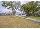 Charming house with a large yard, mature trees, and a long driveway at 277 Debary Dr, Debary, FL 32713