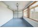 Garage with painted floor, automatic garage door and windows at 277 Debary Dr, Debary, FL 32713