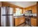 Cozy kitchen featuring stainless steel appliances and wood cabinets at 277 Debary Dr, Debary, FL 32713