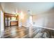 Open living area with wood-look floors and kitchen views at 277 Debary Dr, Debary, FL 32713