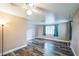 Living room with wood-look floors and ceiling fan at 277 Debary Dr, Debary, FL 32713