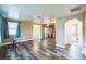 Open living room with wood-look floors and view of kitchen at 277 Debary Dr, Debary, FL 32713