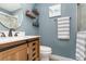 Main bathroom with wood vanity and a walk-in shower at 2824 Oak Lea Dr, South Daytona, FL 32119