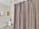 Small bathroom with a shower and gray shower curtain at 3151 Paradox Cir # 107, Kissimmee, FL 34746