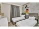Two twin beds in a Mickey Mouse themed bedroom at 3151 Paradox Cir # 107, Kissimmee, FL 34746