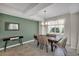 Dining room with green accent wall and lake view at 3151 Paradox Cir # 107, Kissimmee, FL 34746