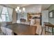 Bright dining room with large table and kitchen access at 3151 Paradox Cir # 107, Kissimmee, FL 34746