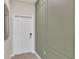 Modern entryway with white door and green accent wall at 3151 Paradox Cir # 107, Kissimmee, FL 34746