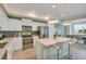 Modern kitchen with stainless steel appliances and an island at 3151 Paradox Cir # 107, Kissimmee, FL 34746