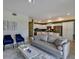 Open living room, modern furniture and kitchen views at 3151 Paradox Cir # 107, Kissimmee, FL 34746