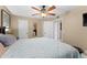 Bright bedroom with ceiling fan and hardwood floors at 365 Forestway Cir # 204, Altamonte Springs, FL 32701