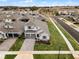 Aerial view of a two-story house and neighborhood at 4558 Lions Gate Ave, Clermont, FL 34711