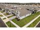 Aerial view of a two-story house with landscaping at 4558 Lions Gate Ave, Clermont, FL 34711