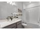 Clean bathroom with a single vanity and bathtub at 4558 Lions Gate Ave, Clermont, FL 34711