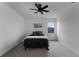 Cozy bedroom with carpeted floor, ceiling fan, and a queen-sized bed at 4558 Lions Gate Ave, Clermont, FL 34711