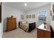 Cozy bedroom with a full-size bed and wood dresser at 4558 Lions Gate Ave, Clermont, FL 34711