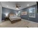 Spacious bedroom with a ceiling fan and ensuite bathroom at 4558 Lions Gate Ave, Clermont, FL 34711
