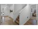 Bright and airy entryway with wood flooring and staircase at 4558 Lions Gate Ave, Clermont, FL 34711