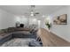 L shaped game room with hardwood floors and a ceiling fan at 4558 Lions Gate Ave, Clermont, FL 34711