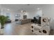 Spacious game room with hardwood floors, sectional sofa, and built-in shelving at 4558 Lions Gate Ave, Clermont, FL 34711