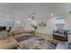 Open concept game room with sectional sofa and large windows at 4558 Lions Gate Ave, Clermont, FL 34711