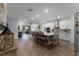 Modern kitchen with island, stainless steel appliances, and hardwood floors at 4558 Lions Gate Ave, Clermont, FL 34711