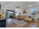 Relaxing living room with large sectional sofa and access to backyard at 4558 Lions Gate Ave, Clermont, FL 34711