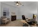 Bright home office with a desk and comfortable chair at 4558 Lions Gate Ave, Clermont, FL 34711