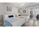 Guest bedroom with two twin beds, ceiling fan, and ocean-themed decor at 4631 S Atlantic Ave # 8605, Ponce Inlet, FL 32127