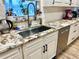 Kitchen sink and granite countertop with modern faucet at 506 Little Wekiva Rd, Altamonte Springs, FL 32714