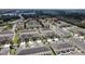 Aerial view of townhouses with ample parking and green spaces at 5120 Adelaide Dr, Kissimmee, FL 34746