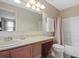Bathroom with tub, shower, toilet and sink at 5120 Adelaide Dr, Kissimmee, FL 34746