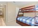 Bunk beds in a bedroom with ample floor space at 5120 Adelaide Dr, Kissimmee, FL 34746