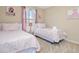 Bedroom with two twin beds, nightstand and window at 5120 Adelaide Dr, Kissimmee, FL 34746