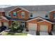 Attractive townhome with two-car garage and landscaping at 5120 Adelaide Dr, Kissimmee, FL 34746