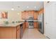 Open concept kitchen with stainless steel appliances and granite countertops at 5120 Adelaide Dr, Kissimmee, FL 34746