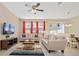 Living room with two sofas, coffee table, and access to dining area at 5120 Adelaide Dr, Kissimmee, FL 34746