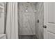 Clean shower with gray tile surround at 532 Hunter Cir, Kissimmee, FL 34758