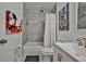 Bathroom with tub, shower, and Mickey Mouse towel at 532 Hunter Cir, Kissimmee, FL 34758