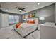 Bright bedroom with a king-size bed, modern nightstands, and stylish decor at 532 Hunter Cir, Kissimmee, FL 34758