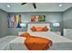Spacious bedroom with king-size bed and orange accents at 532 Hunter Cir, Kissimmee, FL 34758