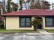 Front view of charming condo with red tile roof and landscaping at 532 Hunter Cir, Kissimmee, FL 34758