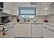 White kitchen with quartz countertops and breakfast bar at 532 Hunter Cir, Kissimmee, FL 34758