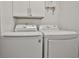 Bright laundry room with LG washer and dryer and white cabinets at 532 Hunter Cir, Kissimmee, FL 34758