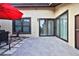 Spacious patio with sliding glass doors and grey tile flooring at 532 Hunter Cir, Kissimmee, FL 34758