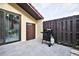 Patio with grill and grey tile flooring at 532 Hunter Cir, Kissimmee, FL 34758