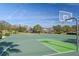 Community basketball court with hoops, lines, and common seating areas at 6124 Cypress Hill Rd, Winter Garden, FL 34787