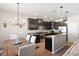 Open kitchen and dining area featuring stainless steel appliances and modern cabinetry at 6124 Cypress Hill Rd, Winter Garden, FL 34787