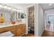 Double vanity bathroom with a shower/tub combo and light wood cabinets at 701 Glasgow Ct # 701, Winter Springs, FL 32708