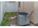 Backyard view of an AC unit and white fence at 716 Katherine St, South Daytona, FL 32119